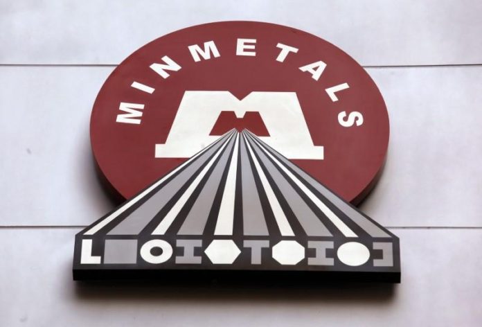 The company logo of Minmetals Resources is displayed outside its headquarters in Hong Kong Minmetals